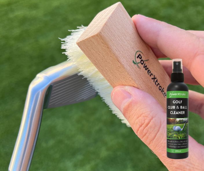 Cleaning a golf club with PowerXtroke brush – removes mud and debris from grooves for better contact
